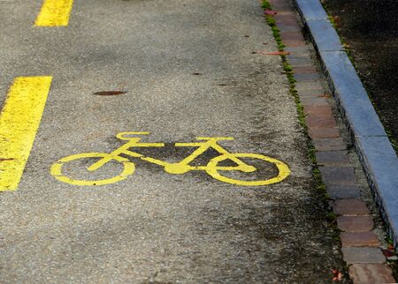 Cycle lane symbol painted on roadの写真素材