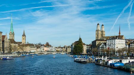 Zurich skyline and the river Limmat with the famous Fraumunster, St. Peter and Grossmunster churches on a sunny day in autumn, Canton of Zurich, Switzerlandのeditorial素材