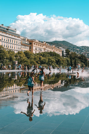 Children playing in the water park in Niceの写真素材