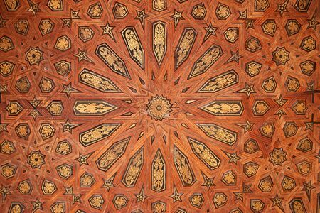 Moorish wood patten on a wall inside world famous Alhambra Palace. Granada Spain.のeditorial素材