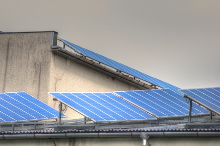 Solar energy. Solar panels at the roof of the building in a cloudy weather.の写真素材