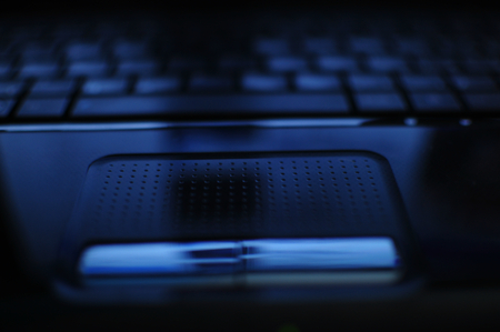 Laptop, personal computer with blue backgroundの写真素材