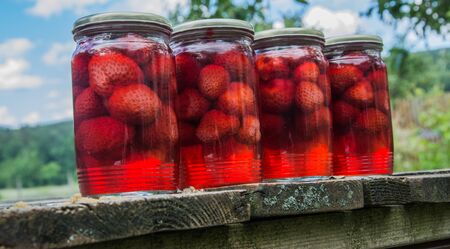 canned strawberries on the tableの写真素材