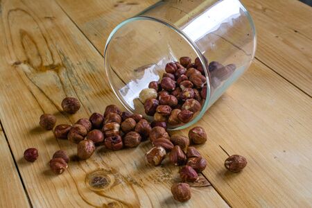 Spilled nuts on wooden table
