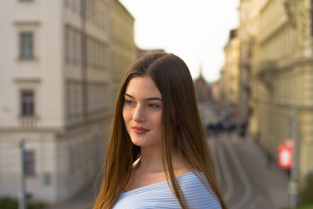 Young girl portrait in city in springの写真素材