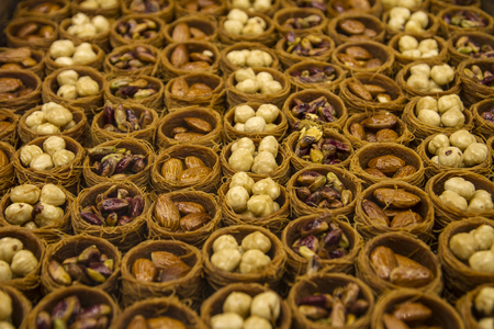 Traditional Turkish dessert prepared with almond, pistachio and hazelnuts.の写真素材
