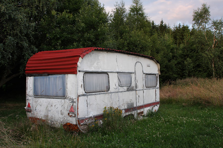 Old white  camper in forestの写真素材