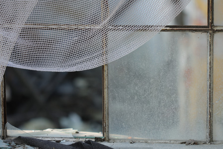 Broken window -photo from demolition  textile  factory in sunny dayの写真素材