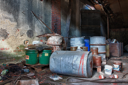 Group of old, rusty barrels with toxic chemical  waste. Photo was taken on place, where textile...