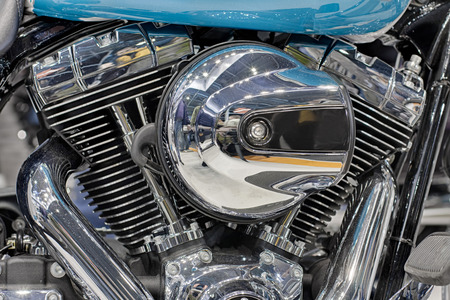 Detail of  air cooled twin engine with integrated oil cooler of motorcycle