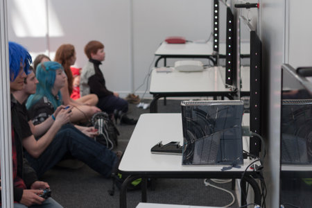 BRNO, CZECH REPUBLIC - APRIL 30, 2016: Unidentified teenagers playing console games at Animefest,...