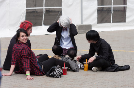BRNO, CZECH REPUBLIC - May 1, 2016: Group of visitors sitting on the ground at Animefest, anime convention on May 1, 2016 Brno, Czech Republicのeditorial素材