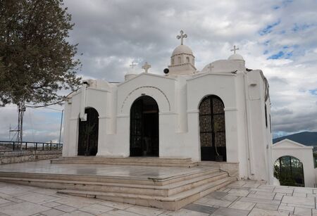 Chapel of Saint George on Mount  Lycabettus at cloudy day. の写真素材