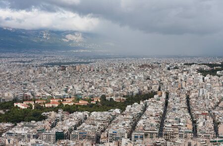 Aerial view of Athens from mount Lycabettus at cloudy day, rain is coming. の写真素材