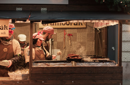 Brno, Czech Republic-December 5, 2016: Sellers of potato pancakes at Christmas market on Liberty Square on December 5, 2016 in Brno, Czech Republicのeditorial素材