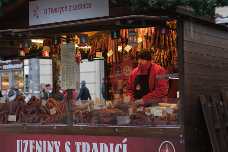 Brno, Czech Republic-December 5.2016: Man sausage sales at Christmas market at Liberty Square on December 5, 2016 in Brno, Czech Republicのeditorial素材