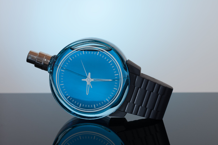 Bottle of perfume on black acrylic sheet.の写真素材