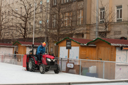 Brno,Czech Republic-December 18,2017: Man in tractor cleans artificial ice rink on Moravian Square on December 18, 2017 Brno, Czech Republicのeditorial素材
