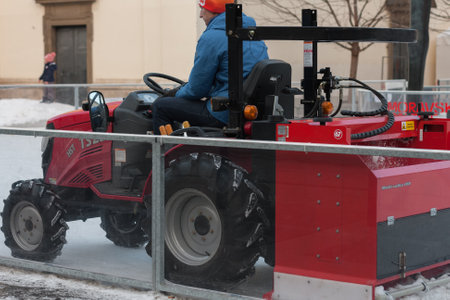 Brno,Czech Republic-December 18,2017: Man in tractor cleans artificial ice rink on Moravian Square on December 18, 2017 Brno, Czech Republicのeditorial素材