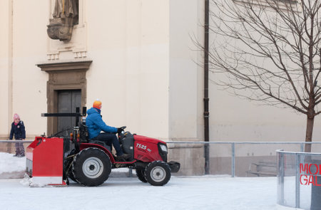Brno,Czech Republic-December 18,2017: Man in tractor cleans artificial ice rink on Moravian Square on December 18, 2017 Brno, Czech Republicのeditorial素材