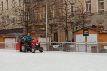Brno,Czech Republic-December 18,2017: Man in tractor cleans artificial ice rink on Moravian Square on December 18, 2017 Brno, Czech Republicのeditorial素材