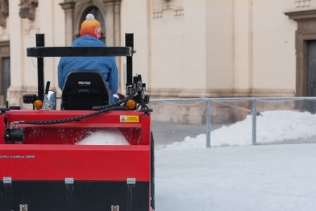 Brno,Czech Republic-December 18,2017: Man in tractor cleans artificial ice rink on Moravian Square on December 18, 2017 Brno, Czech Republicのeditorial素材