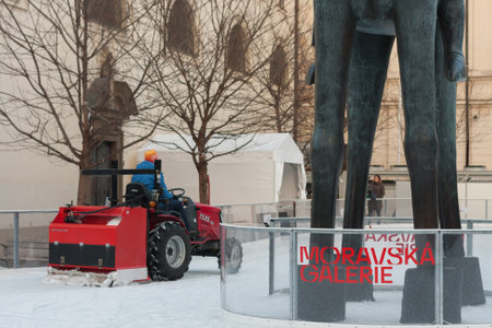 Brno,Czech Republic-December 18,2017: Man in tractor cleans artificial ice rink on Moravian Square on December 18, 2017 Brno, Czech Republicのeditorial素材