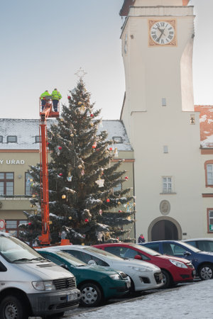 Boskovice ,Czech Republic-December 1,2017: Two men are decorating christmas tree on Masaryk Square on December  1, 2017 Boskovice , Czech Republic,のeditorial素材
