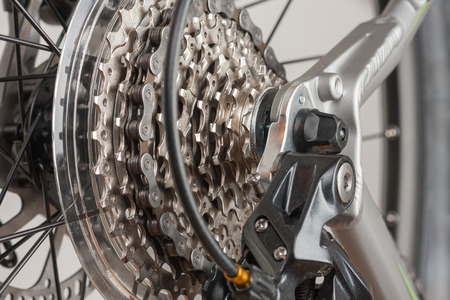 Close up 9-speed cassette on rear wheel of bike, studio photo