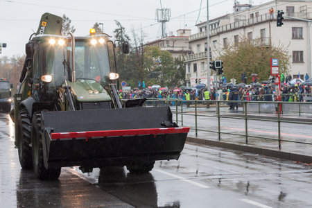 European street, Prague-October 28, 2018: Soldiers of Czech Army are riding backhoe loader JCB 4CX...