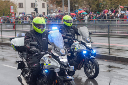 European street, Prague-October 28, 2018: Police workers  are riding motorcycle  on military parade for 100th anniversary of creation Czechoslovakia on October 28, 2018 in Prague, Czech Republicのeditorial素材