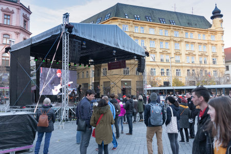 BRNO, CZECH REPUBLIC - NOVEMBER 17, 2019: The stage and people are listening to music on the celebration of 30 years of Velevet Revolution at Liberty Square on November 17, 2019 Brno, Czech Republicのeditorial素材