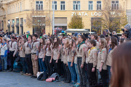 BRNO, CZECH REPUBLIC - NOVEMBER 17, 2019: Scouts making a three-finger salute at the Velevet Revolution celebration at the Liberty Square on November 17, 2019 Brno, Czech Republicのeditorial素材