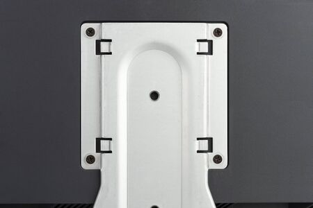 PC Lcd monitor, rear view,  attaching the monitor 4 screws on metal bracket.
