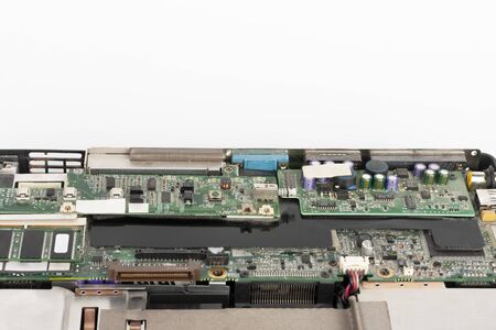 Close up of motherboard old laptop on white background 