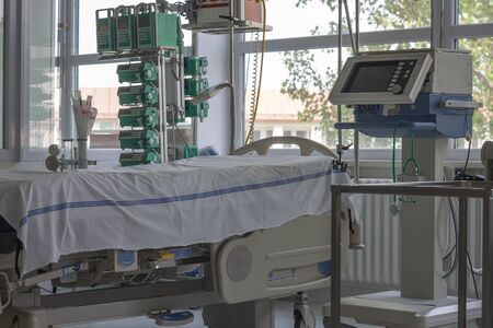 Intensive care unit in hospital, bed with monitor, ventilator, a place where can be  treated...