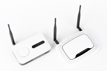 Two wifi routers, wireless devices with one and two antennas on white background.の写真素材