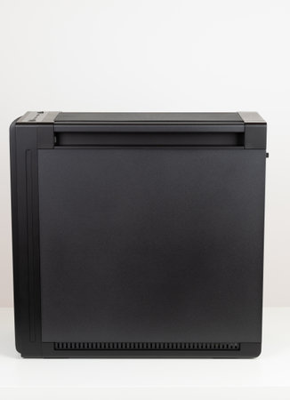 Side view of empty big tower, PC case, chassis, Studio shoot on white background. Removable dust...