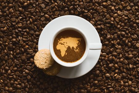 Still life photography of hot coffee beverage with map of Afro-EurAsiaの写真素材