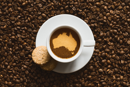 Still life photography of hot coffee beverage with map of Australiaの写真素材