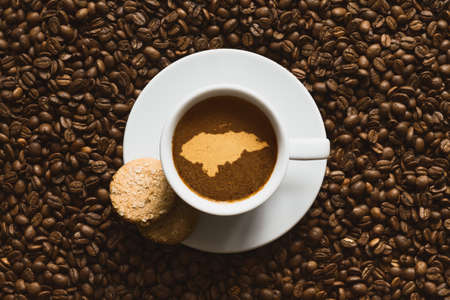 Still life photography of hot coffee beverage with map of Hondurasの写真素材