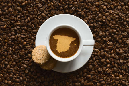 Still life photography of hot coffee beverage with map of Spainの写真素材