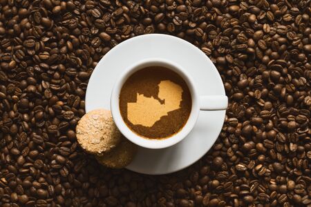 Still life photography of hot coffee beverage with map of Zambiaの写真素材