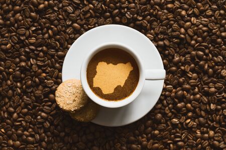 Still life photography of hot coffee beverage with map of Nigeriaの写真素材