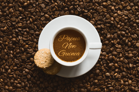 Still life photography of hot coffee beverage with text Papua New Guineaの写真素材