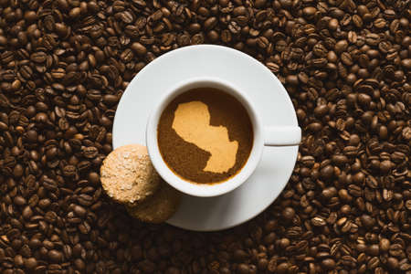 Still life photography of hot coffee beverage with map of Paraguayの写真素材