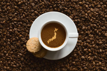 Still life photography of hot coffee beverage with map of Japanの写真素材