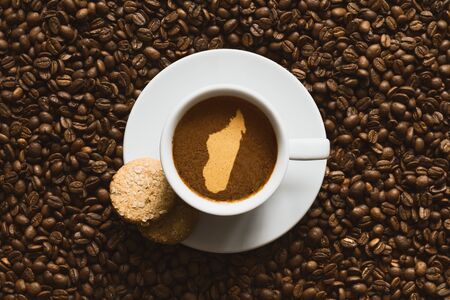 Still life photography of hot coffee beverage with map of Madagascarの写真素材