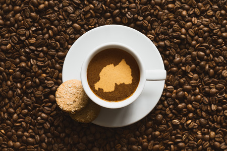 Still life photography of hot coffee beverage with map of Rwandaの写真素材