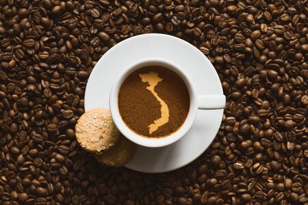 Still life photography of hot coffee beverage with map of Vietnamの写真素材